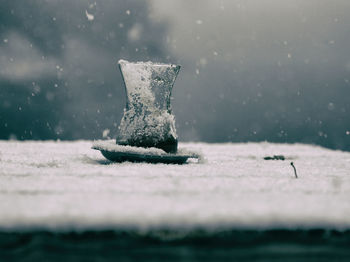 Close-up of water drop on snow