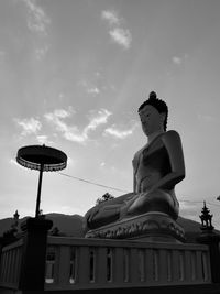 Low angle view of statue against sky