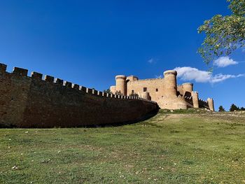 View of fort against blue sky