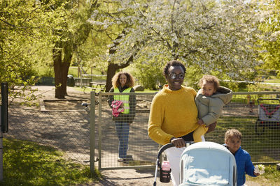 Mother with two daughters in park