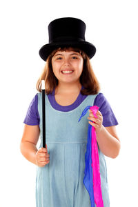 Portrait of smiling girl standing against white background