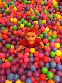 Portrait of smiling girl with colorful balloons