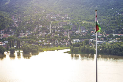 Calm lake against townscape