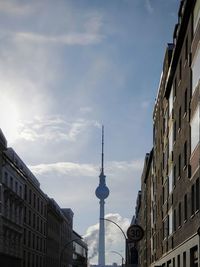 View of buildings against cloudy sky