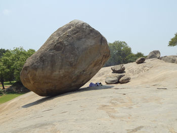 Rock formation on land against clear sky