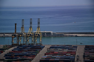 Pier at harbor against sky