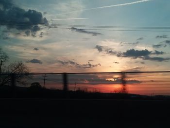 Silhouette bridge against sky during sunset