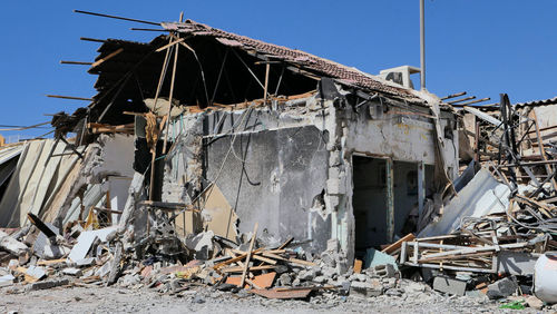 Damaged building against sky