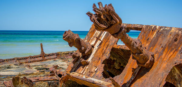 Old ruins on beach against clear sky