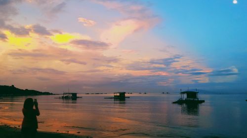 Scenic view of sea at sunset