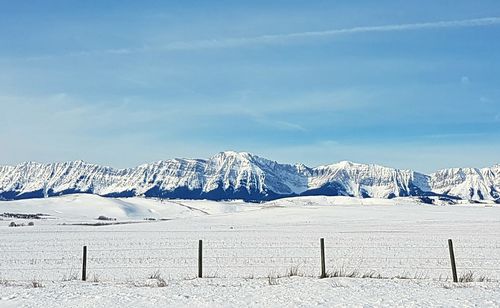 Scenic view of landscape against sky during winter