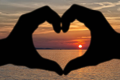 People on beach at sunset