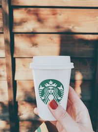 Close-up of hand holding drink