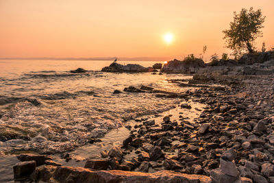 Scenic view of sea against sky during sunset