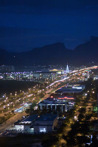 High angle view of illuminated buildings in city at night