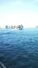 Scenic view of calm sea against blue sky