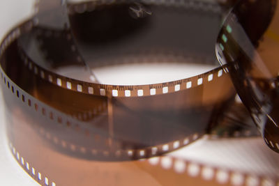 Close-up of film reel against gray background