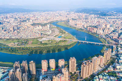 High angle view of river amidst buildings in city