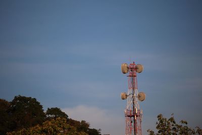 Low angle view of communications tower against sky