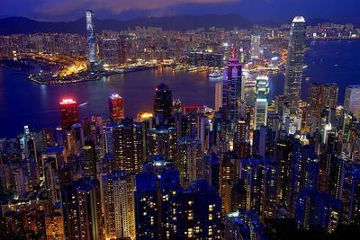 High angle view of city lit up at night