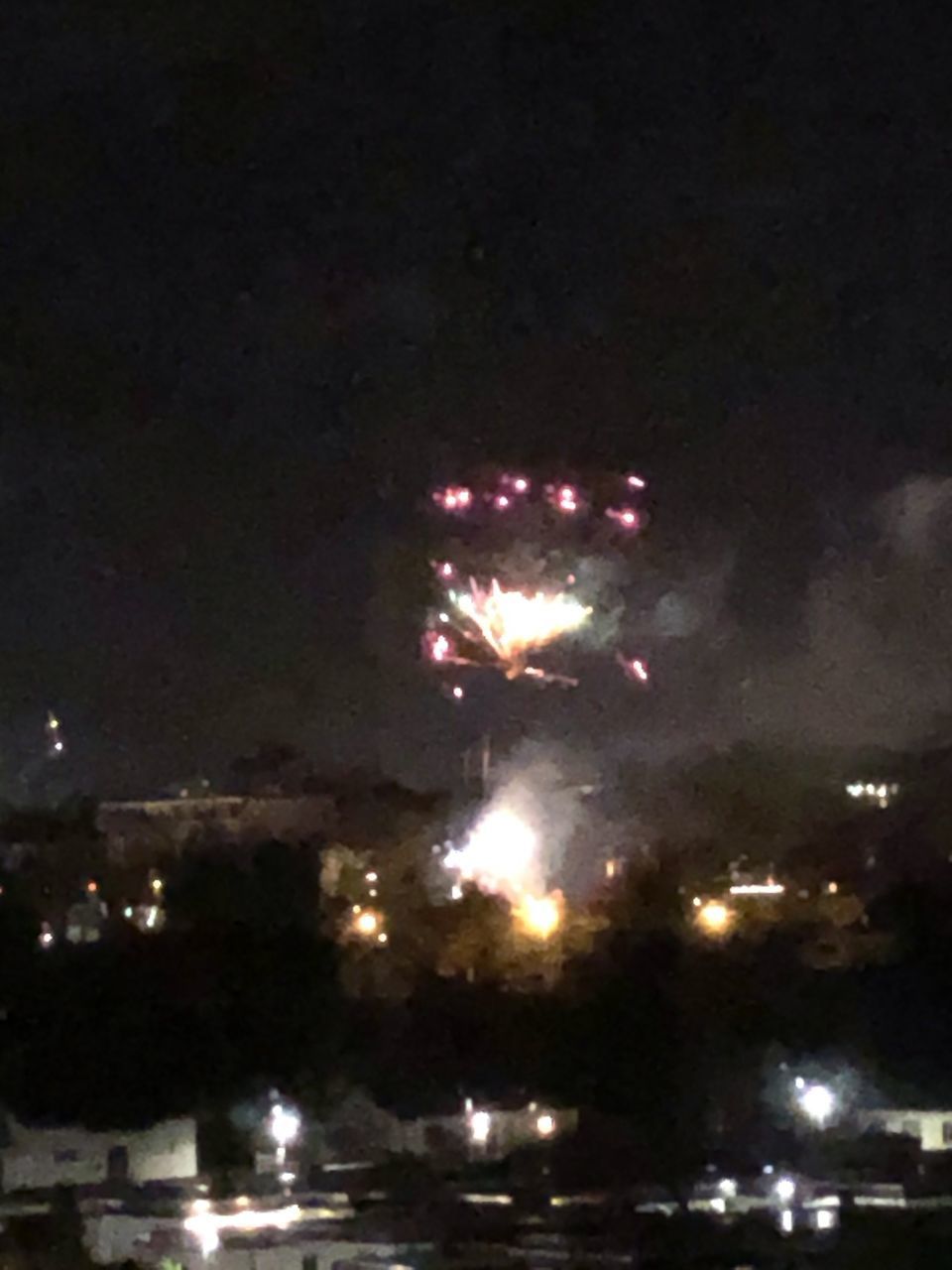 LOW ANGLE VIEW OF FIREWORK DISPLAY IN SKY AT NIGHT