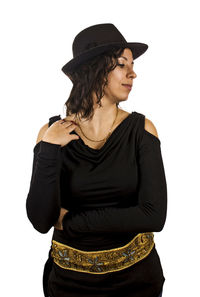 Portrait of young woman standing against white background