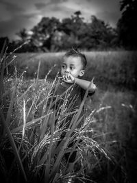 Portrait of boy on field