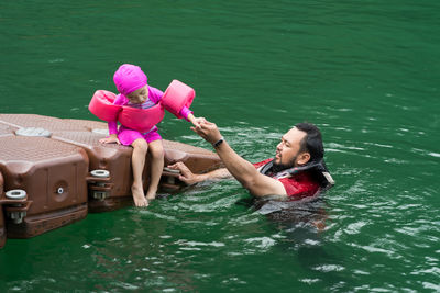 Woman sitting in a lake