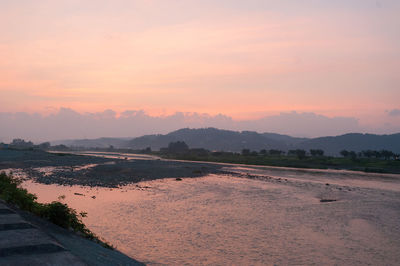 Scenic view of landscape against sky during sunset