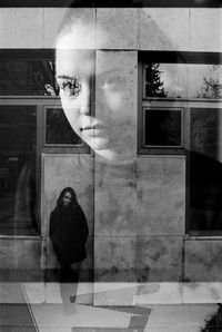 Close-up portrait of woman with reflection on window