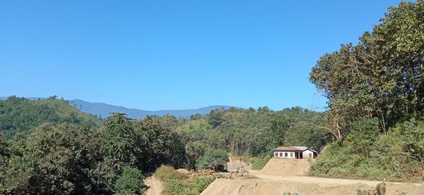 Scenic view of mountains against clear blue sky