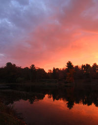 Scenic view of lake at sunset