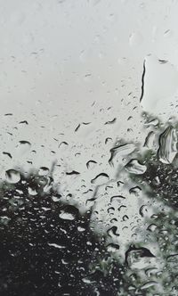 Full frame shot of raindrops on window