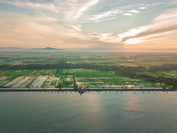 Aerial view of landscape against sky during sunset