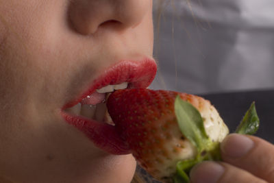 Close-up of woman holding fruit