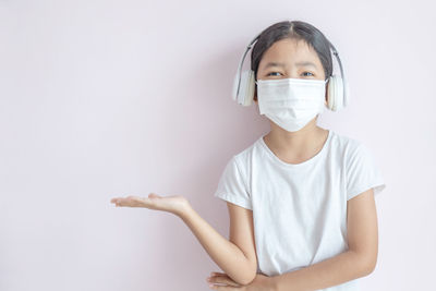 Portrait of girl against white background