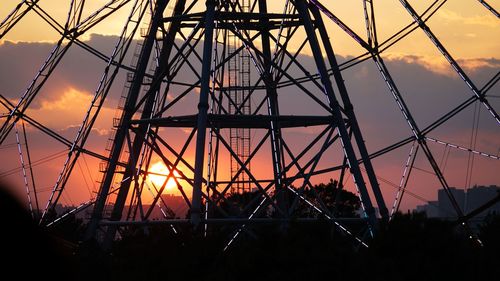 Low angle view of silhouette bridge against sky at sunset
