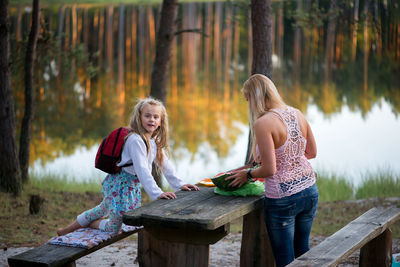 Woman and girl at picnic table