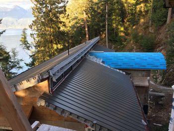 High angle view of gazebo in forest against sky