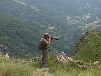 Rear view of man standing on field