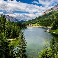 Scenic view of lake and mountains against sky