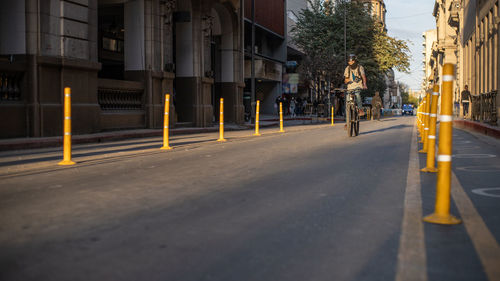 Vehicles on road along buildings