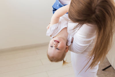 Mother and daughter with baby hair