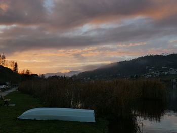 Scenic view of lake against sky during sunset