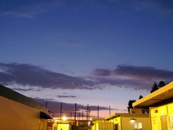 Low angle view of building against cloudy sky
