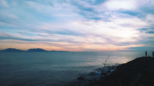 Scenic view of sea against sky at sunset