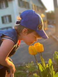 Side view of girl with flower head