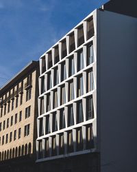 Low angle view of office building against sky