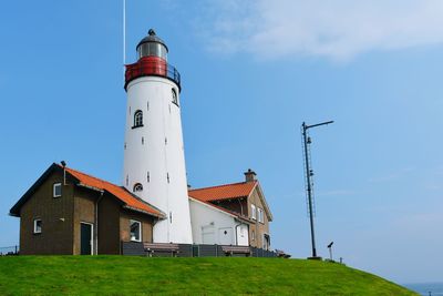 Lighthouse against blue sky