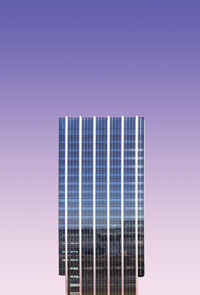 Digital composite image of modern building against colored background
